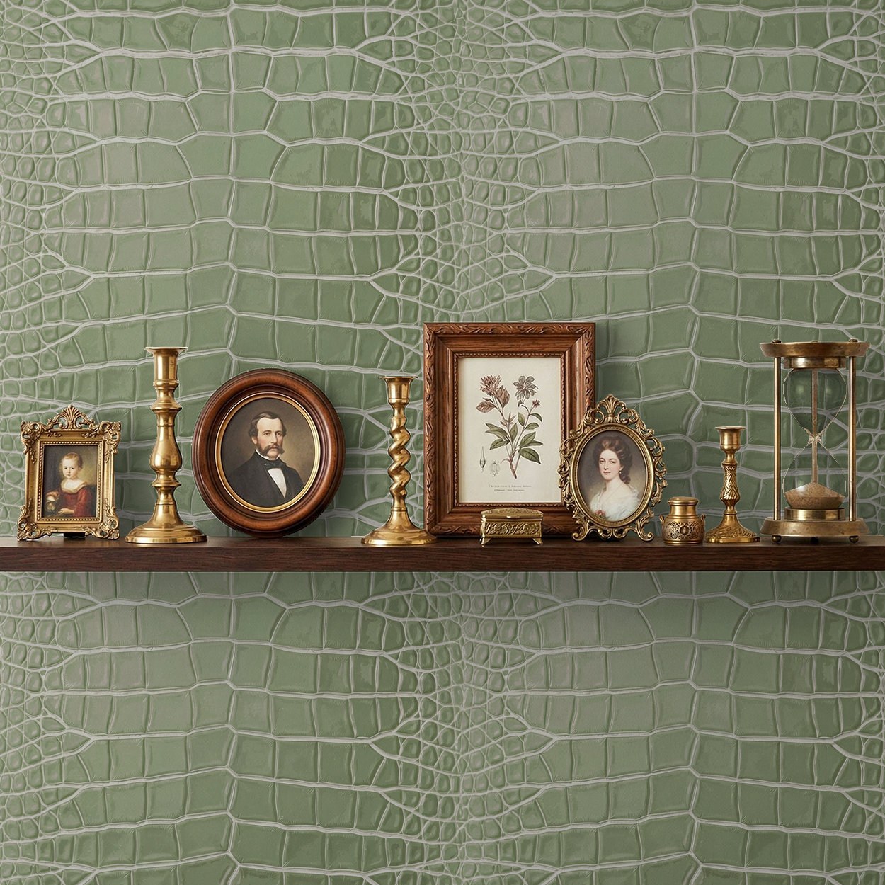 Sage green reptilian patterned wallpaper with vintage decor on a shelf.