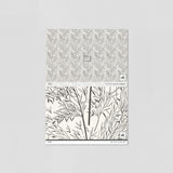 "Wall Blush's Shea Wallpaper sample with tree pattern, ideal for elegant living room décor focus."
