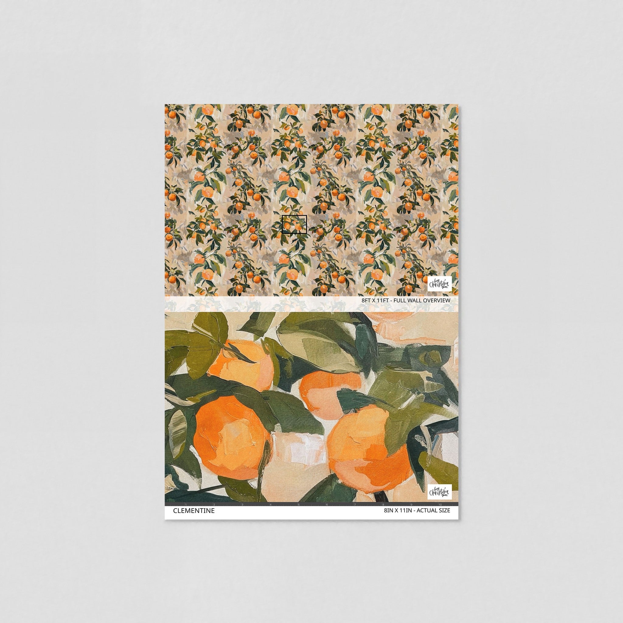 Alt text: "Wall Blush Clementine Wallpaper sample with vibrant orange fruit design, showcased in a modern living room setting, emphasizing the wall decor."