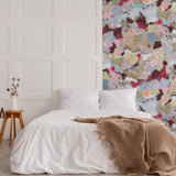 Cozy bedroom featuring abstract Petunia Wallpaper by Wall Blush SG02 as the focal point.
