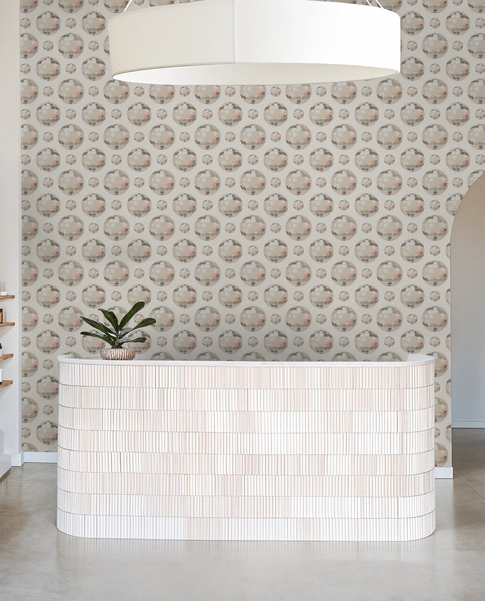 Showtime wallpaper with mirrored globe pattern in taupe and blush, modern reception area.