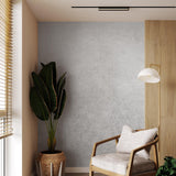 Silver Lining Wallpaper from The Kail Lowry Line in a modern minimalist living space with accent chair.
