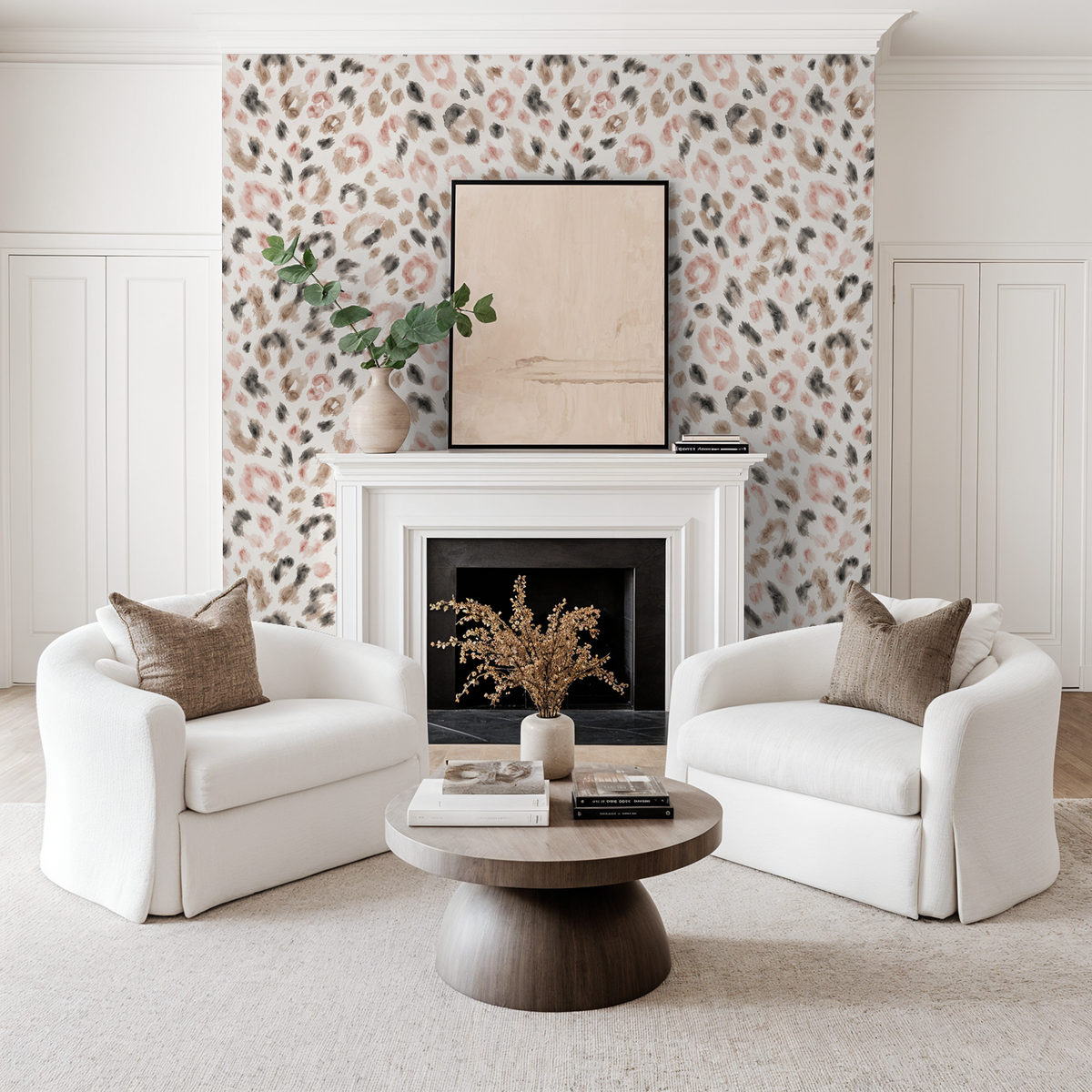 Living room with soft cheetah print wallpaper in muted browns and blushes, white chairs, and fireplace.