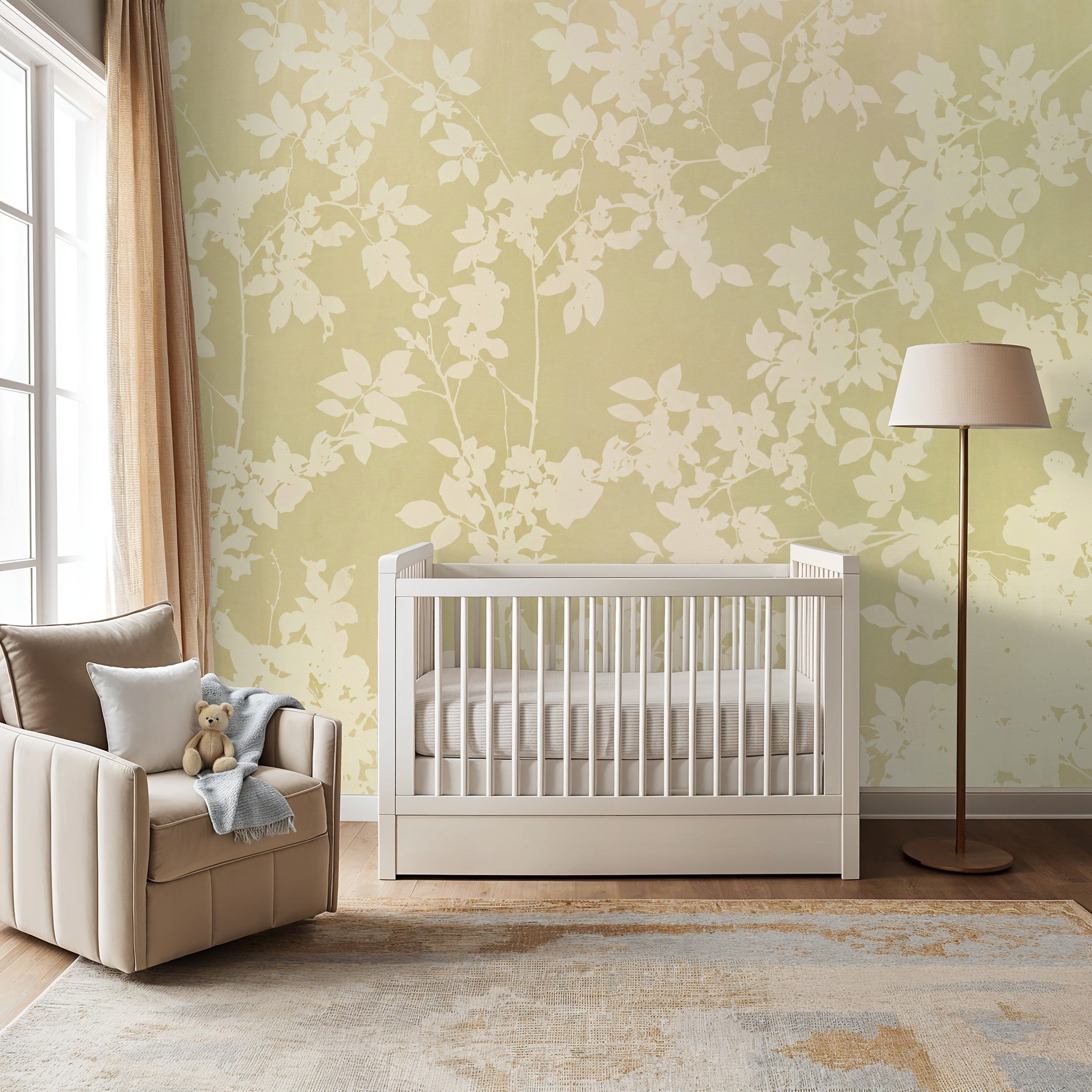 Soft gold and ivory floral wallpaper in nursery with crib and armchair
