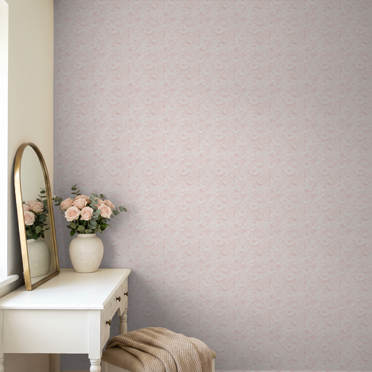 Soft pink floral wallpaper in cozy room with vanity and vase of roses.