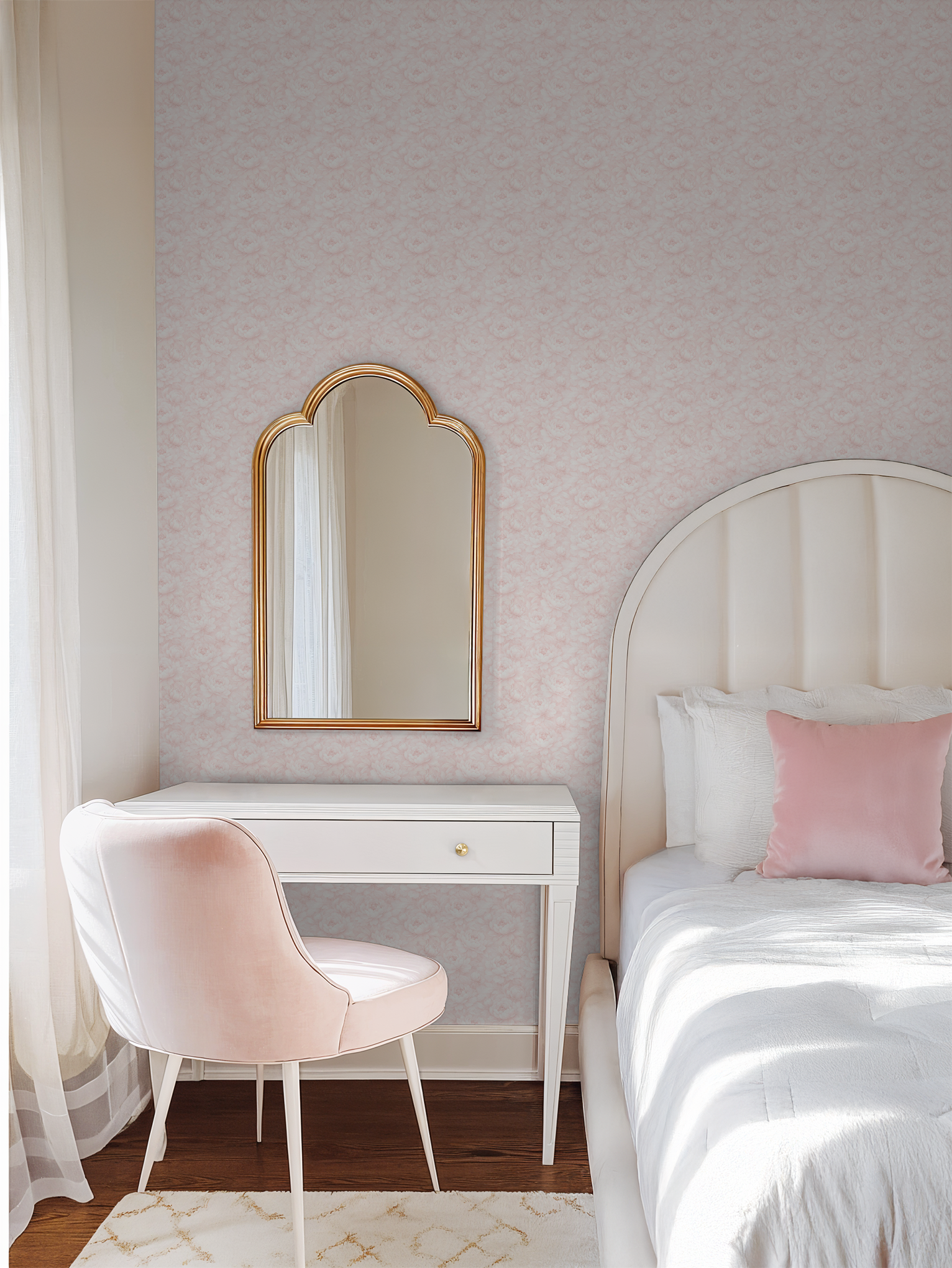 Soft pink floral wallpaper in elegant bedroom with white furniture and mirror.
