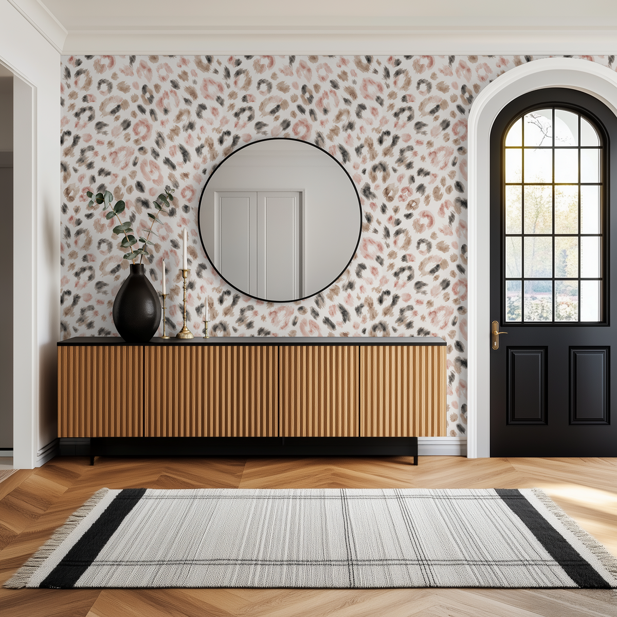 Soft Spot cheetah print wallpaper in muted browns and blushes in modern hallway with wooden console.