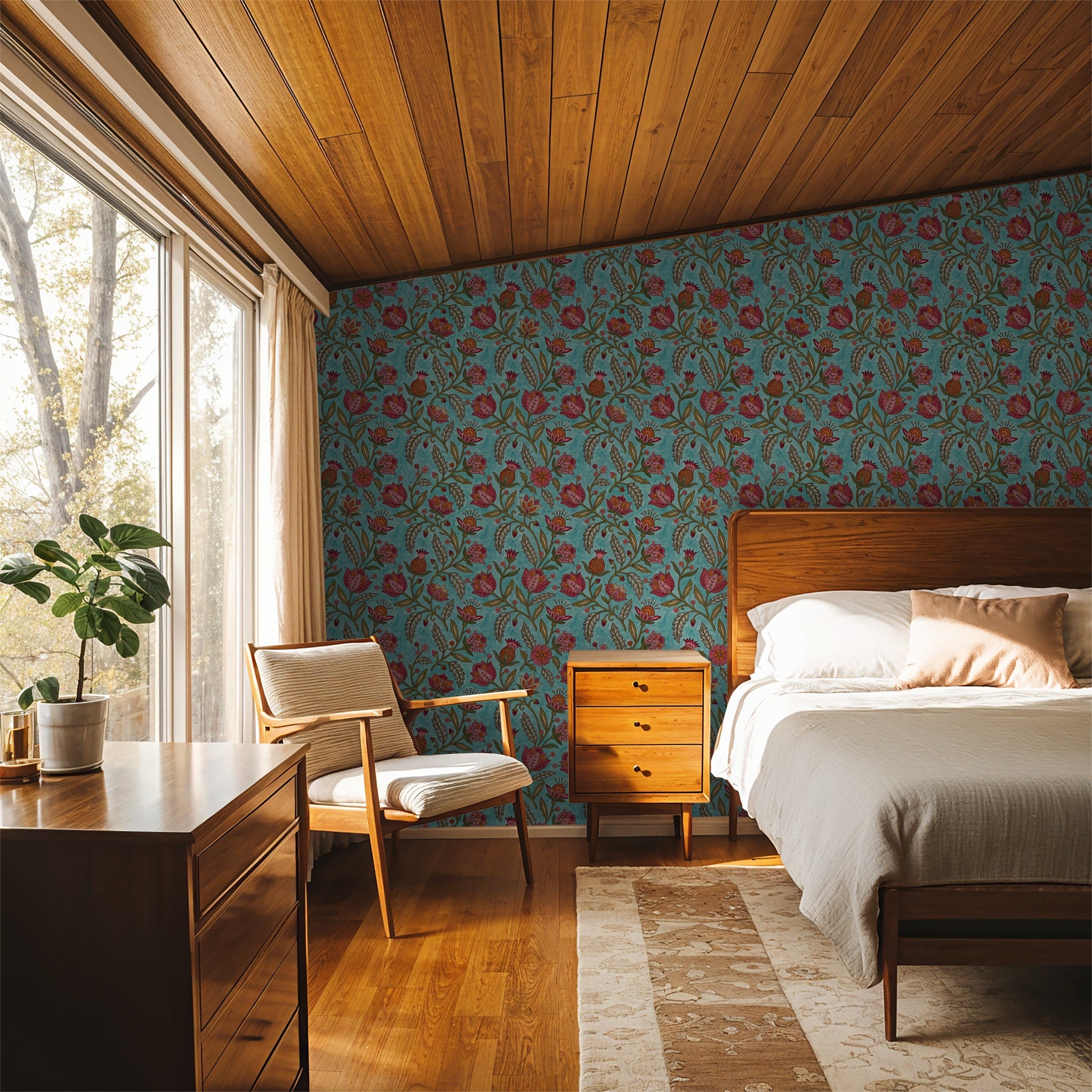 Teal floral wallpaper with red and orange motifs in a vintage bedroom setting.