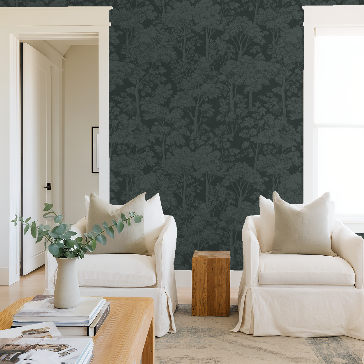 Teal tree canopy wallpaper in serene living room with white chairs.