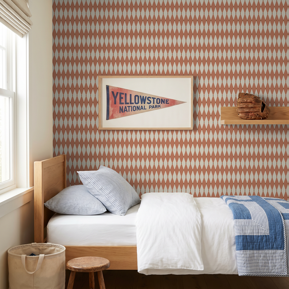 Terracotta diamond pattern wallpaper in cozy bedroom with wooden bed and framed artwork.