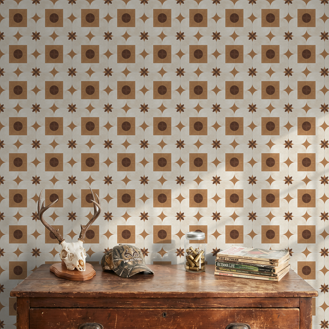 Terracotta and cream geometric wallpaper in rustic room with antler decor.
