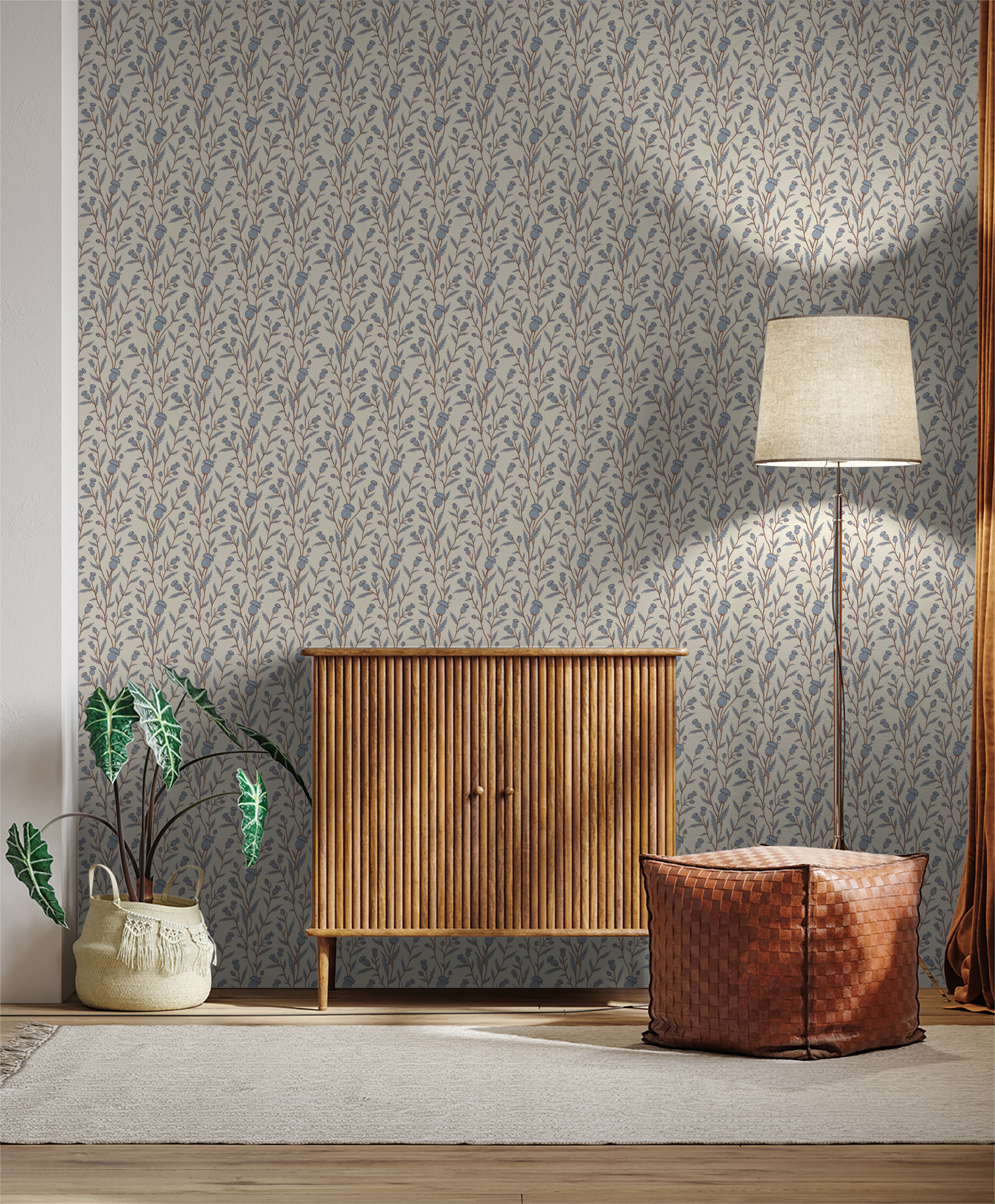 Thistle motif wallpaper in blue and brown with wooden cabinet and floor lamp.