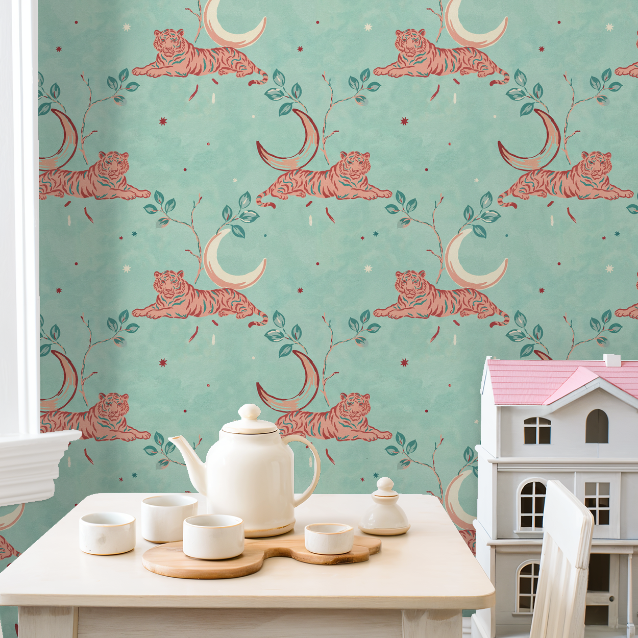 Whimsical tiger wallpaper with moons and foliage on aqua in playful room setting.