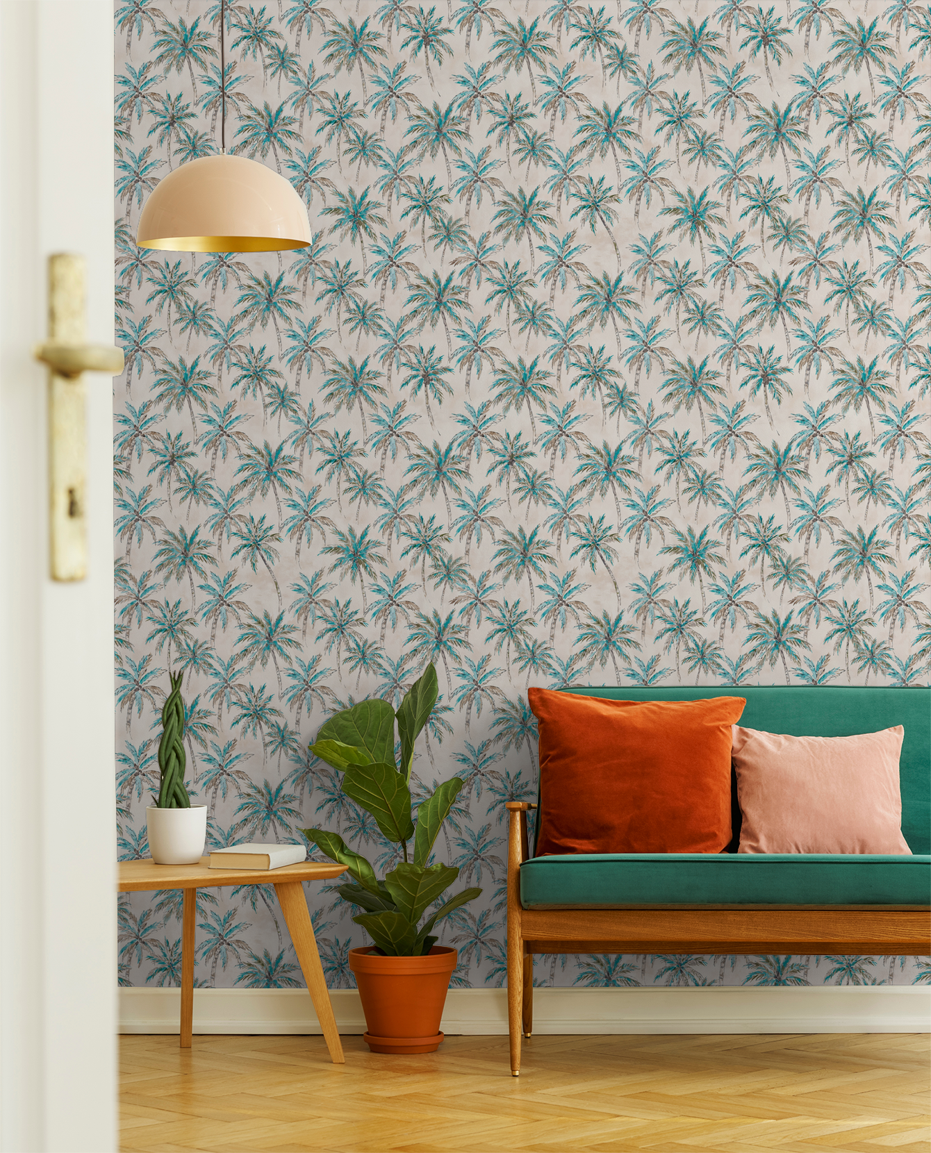 Tropical palm tree wallpaper in turquoise and brown with green sofa and plants in living room.