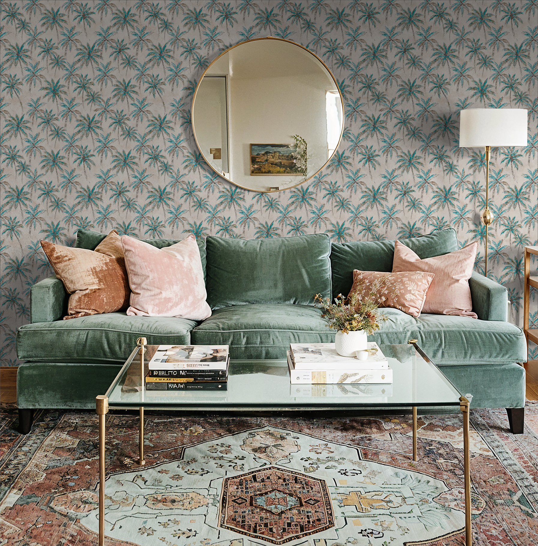 Tropical palm wallpaper in a cozy living room with green sofa and round mirror.