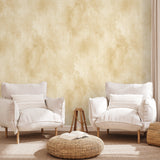 "Wall Blush Champagne Wallpaper in elegant living room setting with plush white armchairs focused on wall decor"