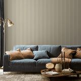 "Little Haven Wallpaper from Wall Blush in stylish living room with plush blue sofa and elegant decor."