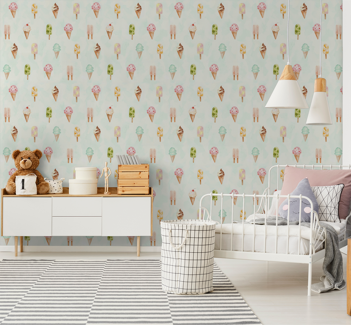 Whimsical ice cream and popsicle wallpaper in a pastel-themed kid's bedroom with a white bed and striped rug.