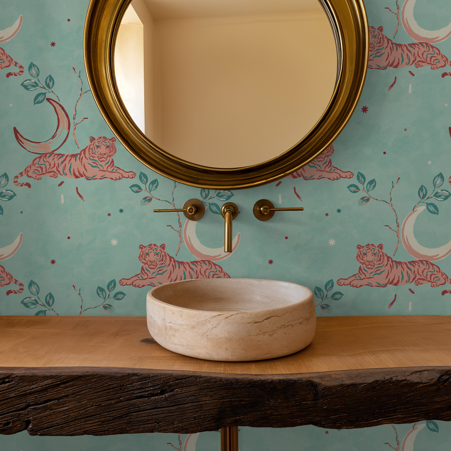 Whimsical tiger and crescent moon wallpaper in aqua with coral accents in bathroom setting.