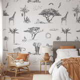 "Pride Lands Wallpaper by Wall Blush in cozy bedroom setting, showcasing African safari animals design focus."