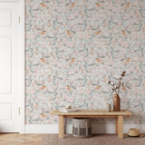 Arden Wallpaper by Wall Blush adorned in a cozy living room with floral bird design, enhancing wall focus.