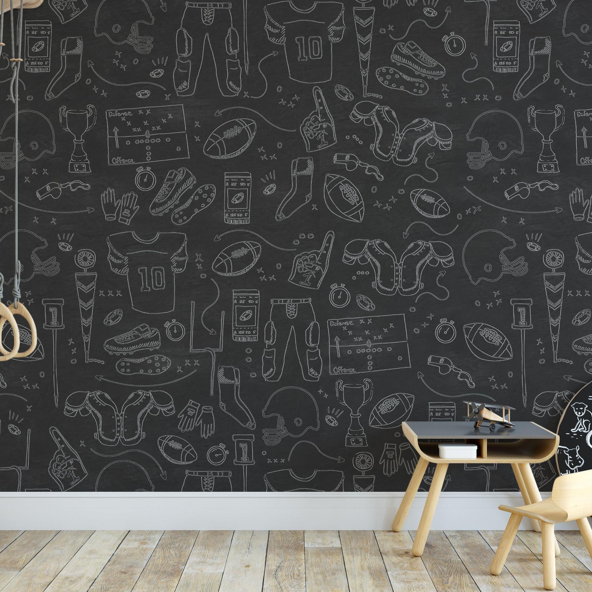 Blitz Wallpaper by Wall Blush SM01 in a kids' room with sports-themed chalkboard-style design.
