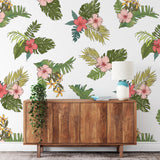 "Mahalo Wallpaper by Wall Blush in a stylish living room, emphasizing vibrant tropical patterns on the focus wall."