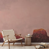 "Wall Blush Heart Thief Wallpaper in a cozy reading nook with chair and side table, focus on elegant wall design."