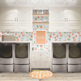 Peachy Clean Wallpaper by Wall Blush, brightening a modern laundry room with fruit motifs.
