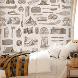 Cozy bedroom featuring Scout (Brown) Wallpaper by Wall Blush SG02 with adventure-themed decor.
