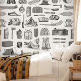 Scout (Black) Wallpaper by Wall Blush SG02 in cozy bedroom setting, highlighting intricate outdoor-themed designs.
