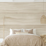 Fraya (Oatmeal) Wallpaper from The Ania Zwara Line in a modern, serene bedroom setting, highlighting the textured design.
