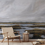 "Beyond the Marsh Wallpaper from Wall Blush featured in modern living room with stylish armchair and decor."