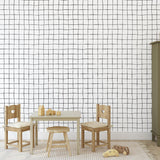 Buxton Wallpaper by Wall Blush SG02 in a stylish children's room, showcasing clean grid design focus.
