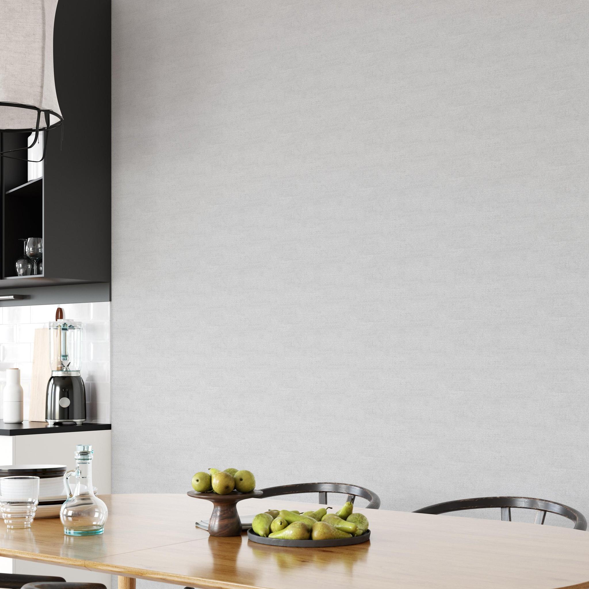 Modern dining room featuring The Clements Crew Line's Carefree (Grey) Wallpaper with minimalist decor.
