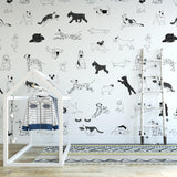 "Child's room decorated with Wall Blush Puppy Love Wallpaper featuring playful dog illustrations."