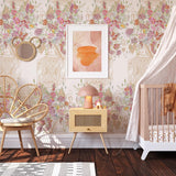 Dynasty Wallpaper by The Katie Small Line enhancing nursery room with floral and gold patterns.

