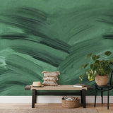 "Emerald Wallpaper by Wall Blush with brush strokes design in a stylish living room setting."