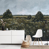 "Wall Blush's Field of Dreams Wallpaper displayed in a modern living room with minimalist furniture."