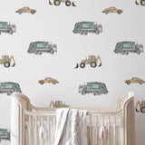 The Salem Gideon Line's Wheels on Wheels Wallpaper in a nursery, with playful vehicle designs.
