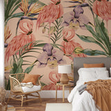 "Wall Blush Flamenco Wallpaper in a cozy bedroom setting, with an emphasis on the vibrant tropical motif."
