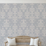 Little Debbie's Damask Wallpaper from The 7th Haven Interiors Line in a cozy living room setting.
