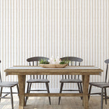 Monroe pattern Wall Blush AW01 wallpaper in a stylish dining room with wooden table and chairs.
