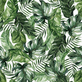 "Wall Blush Good Vibes Wallpaper with tropical leaf design in a modern living room setting."