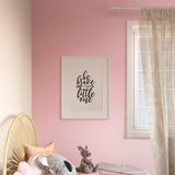 Pretty in Pink Wallpaper from The Clements Crew Line in a cozy bedroom setting with focus on the wall design.
