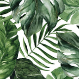 "Wall Blush Good Vibes Wallpaper with tropical leaves design in a modern living room interior."