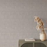"Modern Wall Blush Greyson Wallpaper in stylish living room, with elegant home decor accents."