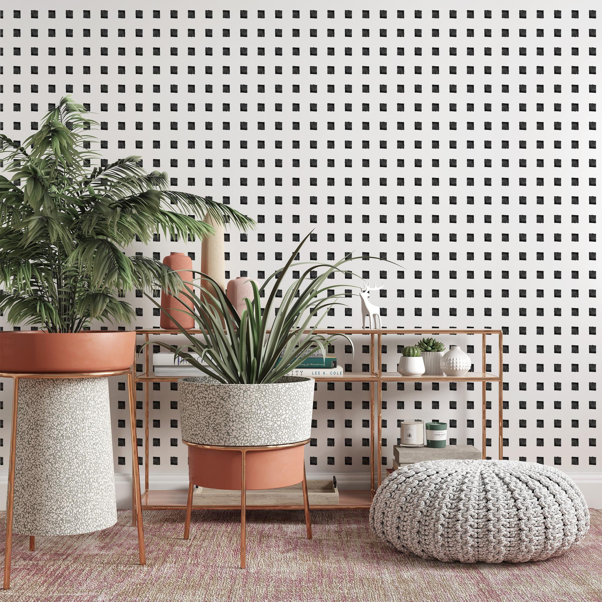 "The Tara Wallpaper by Wall Blush in a modern living room with decorative plants and stylish furniture."