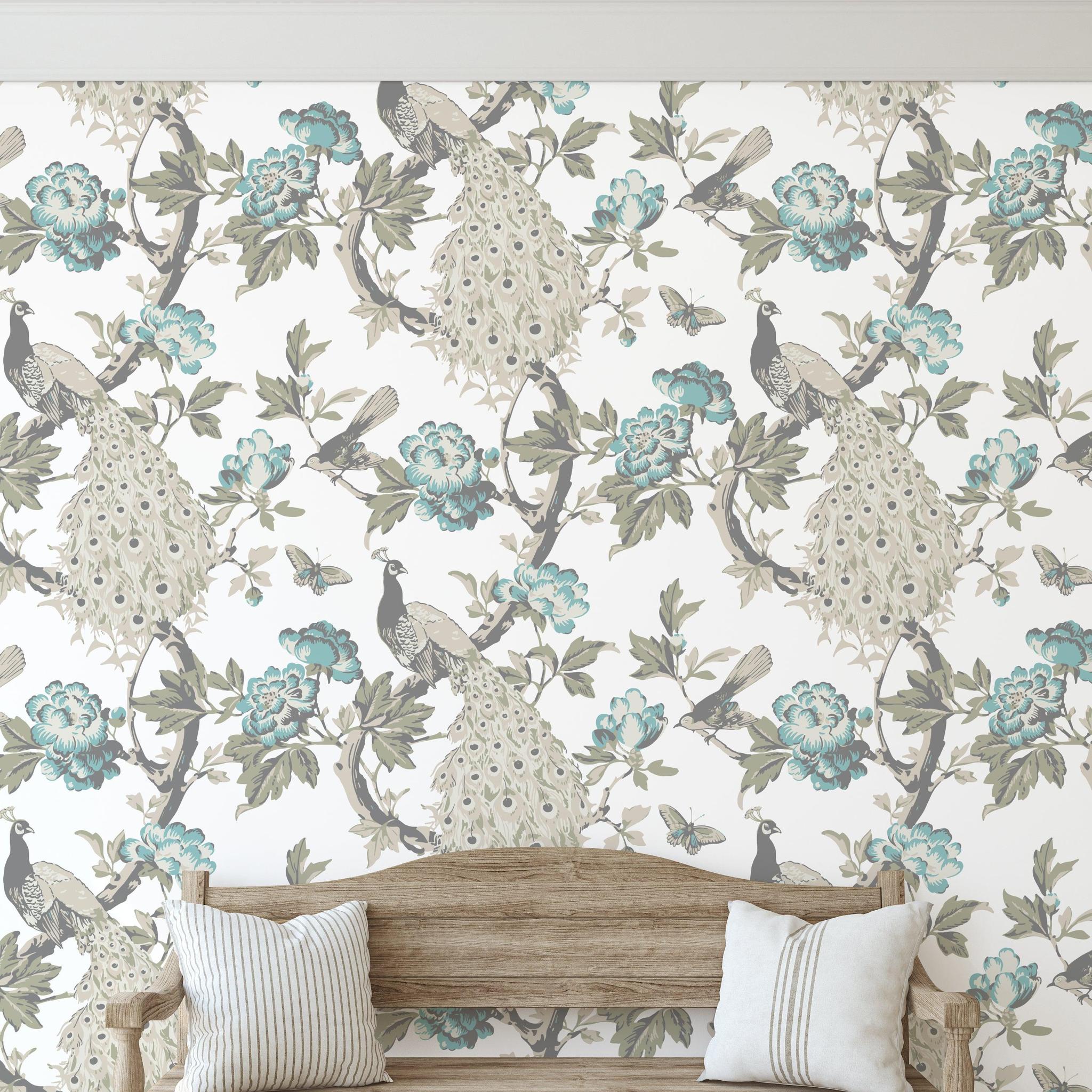 Hera (Blue) Wallpaper from Wall Blush SG02 in a cozy living room, highlighting the elegant peacock design.

