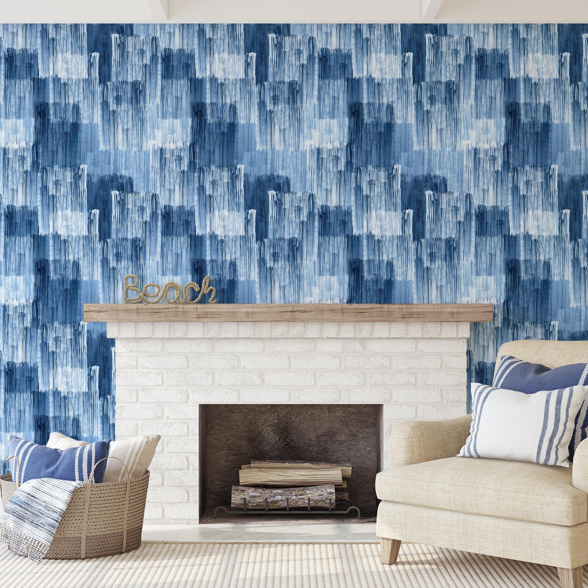 Wall Blush Indigo Wallpaper featured in stylish coastal living room, enhancing wall decor focus.
